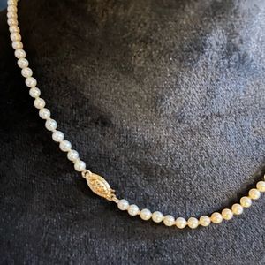 Gorgeous 14kT Pearl necklace individually tied. Very small pearls with 14k clasp